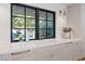 Bright kitchen with large sink, marble counters, and modern fixtures at 204 Canyon Dr, Las Vegas, NV 89107