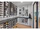 Custom wine cellar featuring an extensive collection, granite countertop, and stylish wall-mounted racks at 204 Canyon Dr, Las Vegas, NV 89107