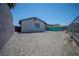 Backyard featuring gravel and a chainlink fence at 215 Zinc St, Henderson, NV 89015