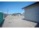 Backyard area with rock and chainlink fence at 215 Zinc St, Henderson, NV 89015