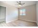 The bedroom offers laminate flooring, a ceiling fan, a closet and a window, creating a clean, modern space at 215 Zinc St, Henderson, NV 89015