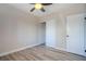 A bedroom showcasing wood-look floors, ceiling fan and closet at 215 Zinc St, Henderson, NV 89015