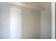 An empty closet with a shelf and clothes hanger rail at 215 Zinc St, Henderson, NV 89015