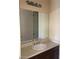 Bathroom sink with modern fixtures and a large mirror at 2175 Clearwater Lake Dr, Henderson, NV 89044