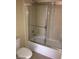 Bathroom featuring tub with shower and a toilet at 2175 Clearwater Lake Dr, Henderson, NV 89044