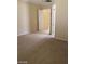 Spacious bedroom with plush carpeting, open doors and neutral walls at 2175 Clearwater Lake Dr, Henderson, NV 89044