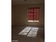 Cozy bedroom featuring neutral carpet, big window with great sunlight and a contemporary design at 2175 Clearwater Lake Dr, Henderson, NV 89044