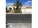 Charming single-story home featuring a 2-car garage and desert landscaping at 2175 Clearwater Lake Dr, Henderson, NV 89044