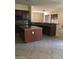 Modern kitchen featuring granite countertops, a kitchen island, and tile flooring at 2175 Clearwater Lake Dr, Henderson, NV 89044