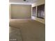 Bright living room with large windows, plush carpet and lots of sunlight at 2175 Clearwater Lake Dr, Henderson, NV 89044