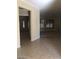 Open-concept living room with neutral tile floors and ample natural light at 2175 Clearwater Lake Dr, Henderson, NV 89044