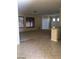Open-concept living space with carpet and tile flooring and natural lighting at 2175 Clearwater Lake Dr, Henderson, NV 89044