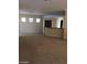 Spacious living room with neutral carpeting and bright, natural light at 2175 Clearwater Lake Dr, Henderson, NV 89044
