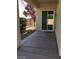 A concrete patio extends from the residence to an outdoor area with trees and gravel at 2175 Clearwater Lake Dr, Henderson, NV 89044