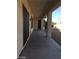 A view of the covered patio and access to the gravel-covered backyard from the back door at 2175 Clearwater Lake Dr, Henderson, NV 89044