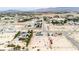 Wide aerial shot of home in a desert community, showcasing its surroundings and spaciousness at 2251 Bridger St, Pahrump, NV 89048