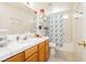 Bright bathroom features a shower-tub combo and a decorative shelf at 2251 Bridger St, Pahrump, NV 89048