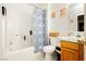 Cozy bathroom features a shower-tub combo and a floral shower curtain at 2251 Bridger St, Pahrump, NV 89048