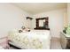 Spacious bedroom features a full bed, a dark wood dresser, and carpet flooring at 2251 Bridger St, Pahrump, NV 89048