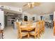 Open dining area featuring a wooden table and chairs, with a view of the kitchen and living room at 2251 Bridger St, Pahrump, NV 89048
