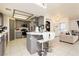 Modern kitchen featuring gray cabinets, stainless steel appliances, tile countertops, and a breakfast bar at 2251 Bridger St, Pahrump, NV 89048