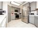 Spacious kitchen features gray cabinets, tile floors, and stainless steel appliances at 2251 Bridger St, Pahrump, NV 89048
