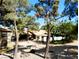 Community pool with trees, desert landscaping, and walking paths in a well-maintained HOA at 2451 N Rainbow Blvd # 2073, Las Vegas, NV 89108