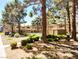 Inviting community pool with well-maintained desert landscaping and nearby building at 2451 N Rainbow Blvd # 2073, Las Vegas, NV 89108