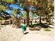 Community amenities include a pool and a BBQ area with mature trees at 2451 N Rainbow Blvd # 2073, Las Vegas, NV 89108