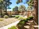 Well-maintained community pool area framed by mature trees and landscaping at 2451 N Rainbow Blvd # 2073, Las Vegas, NV 89108