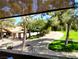 Lush community landscape featuring a pool, walking paths, and mature trees at 2451 N Rainbow Blvd # 2073, Las Vegas, NV 89108