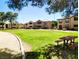 Scenic view of community buildings and a picnic area on a lush green lawn at 2451 N Rainbow Blvd # 2073, Las Vegas, NV 89108