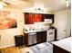 Well-lit kitchen featuring stainless steel appliances, granite countertops and wood cabinets at 2451 N Rainbow Blvd # 2073, Las Vegas, NV 89108
