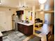 Open-concept kitchen with dining area and stainless steel refrigerator at 2451 N Rainbow Blvd # 2073, Las Vegas, NV 89108