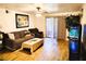 Relaxing living room with wood floors, sliding glass doors, and comfortable seating at 2451 N Rainbow Blvd # 2073, Las Vegas, NV 89108