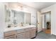Bathroom with vanity, mirror and tile countertops at 2851 S Valley View Blvd # 1071, Las Vegas, NV 89102