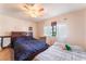 Cozy bedroom featuring two beds, a ceiling fan, and natural light from the window at 2851 S Valley View Blvd # 1071, Las Vegas, NV 89102