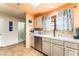 Bright kitchen featuring stainless steel appliances, tile flooring, and a view to the entryway at 2851 S Valley View Blvd # 1071, Las Vegas, NV 89102
