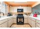 Well-lit kitchen showcasing modern appliances, ample counter space, and stylish tile flooring at 2851 S Valley View Blvd # 1071, Las Vegas, NV 89102