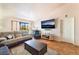 Well-lit living room with a cozy rug, a flat-screen TV, and access to a window with a view at 2851 S Valley View Blvd # 1071, Las Vegas, NV 89102