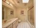 Bathroom featuring a double sink vanity, large mirror, tile flooring, and a shower/tub combo at 2851 S Valley View Blvd # 1199, Las Vegas, NV 89102