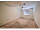 This bedroom features neutral-toned walls, a ceiling fan, and plush carpeting for a cozy and inviting atmosphere at 2851 S Valley View Blvd # 1199, Las Vegas, NV 89102