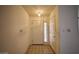 Entryway with neutral tile flooring, a white front door with sidelight, and a coat closet at 2851 S Valley View Blvd # 1199, Las Vegas, NV 89102