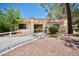 Single-story stucco home with desert landscaping and a walkway that leads to the front door at 2851 S Valley View Blvd # 1199, Las Vegas, NV 89102