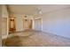 Spacious living room with carpeted floors, ceiling fan, and sliding door closet at 2851 S Valley View Blvd # 1199, Las Vegas, NV 89102