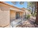 Outdoor patio with a metal railing that is surrounded by trees, perfect for relaxing and entertaining at 2851 S Valley View Blvd # 1199, Las Vegas, NV 89102