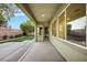 Outdoor patio with ample seating space, low maintenance landscaping, and brick perimeter wall at 2921 Guillemot Ave, North Las Vegas, NV 89084