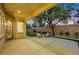 An outdoor patio with comfortable seating and a tree, perfect for entertaining at 2921 Guillemot Ave, North Las Vegas, NV 89084