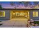Back yard with ample patio space, manicured landscaping, and exterior home access at 2921 Guillemot Ave, North Las Vegas, NV 89084