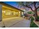 A spacious outdoor patio with comfortable seating and a tree, perfect for relaxing at 2921 Guillemot Ave, North Las Vegas, NV 89084